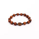 Brǎțarǎ elastic bile lemn si cruce lemn.  OT08-110