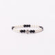 Brǎțarǎ elastic bile perlǎ si cruce metal.  AB100set