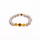 Brǎțarǎ elastic bile marmorate si cruce metal aurie.  OT33-259