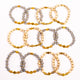 Brǎțarǎ elastic bile marmorate si cruce metal aurie.  OT33-259